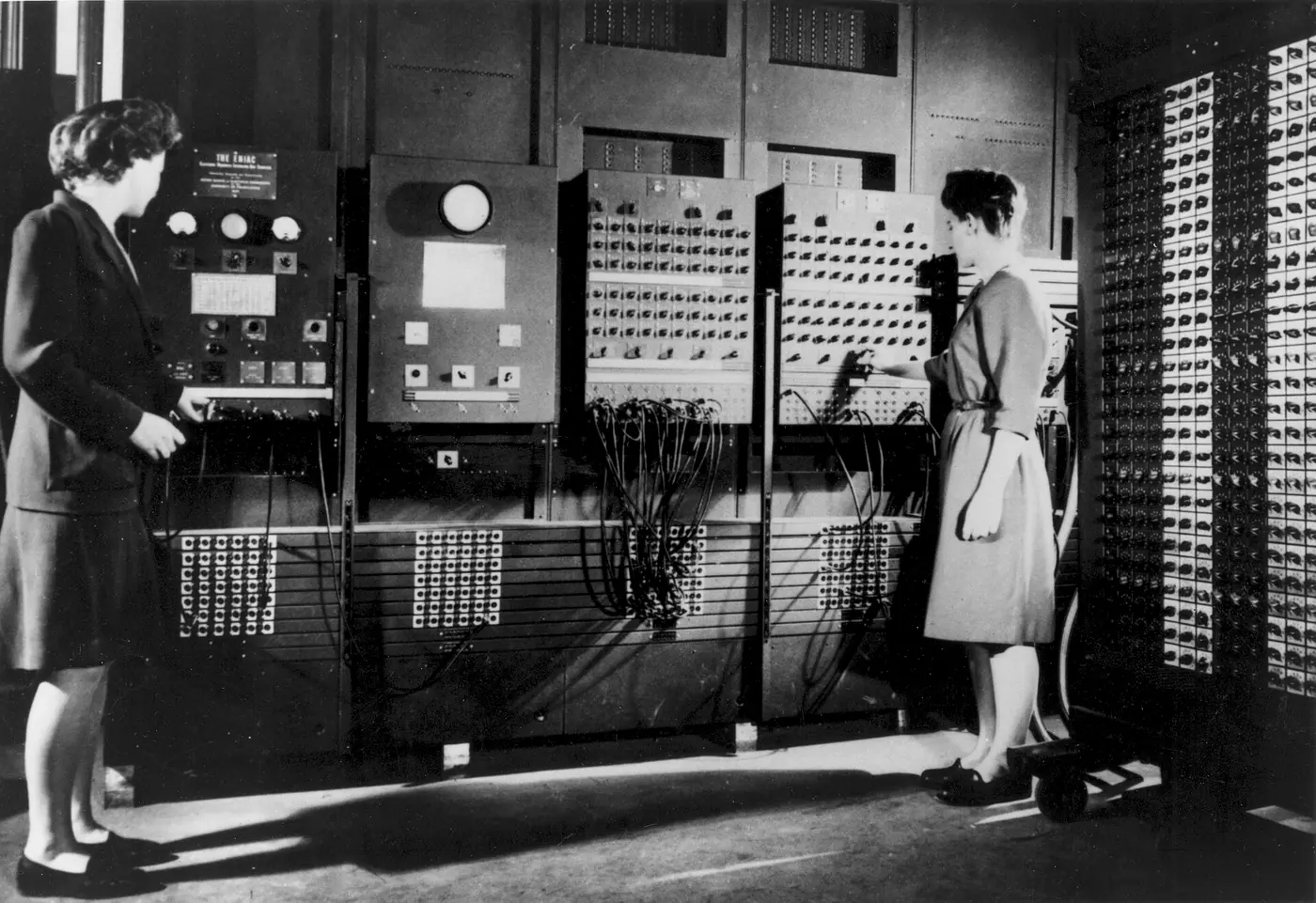 Two programmers setting up the ENIAC computer in 1946